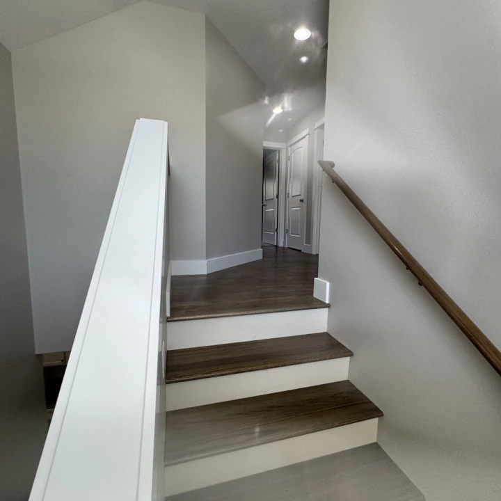 A clean and neat interior staircase landing painted by JLS Painting