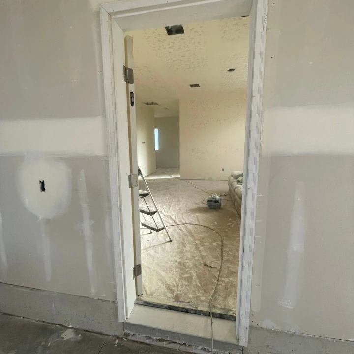 Clean and taped drywall around a doorframe