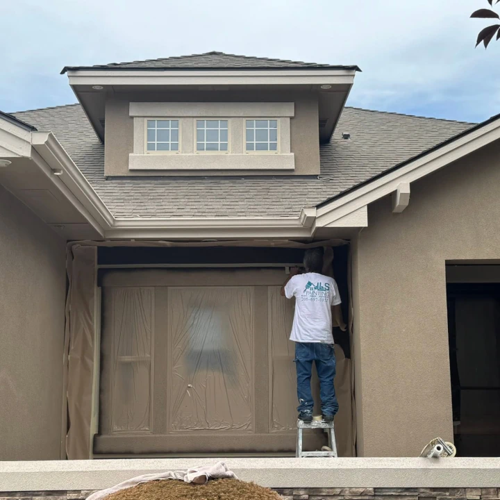 Exterior painting of a stucco house by JLS Painting
