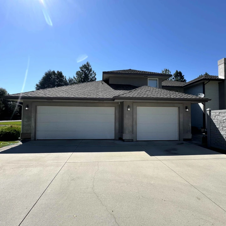 A home and driveway pressure washed clean by JLS Painting